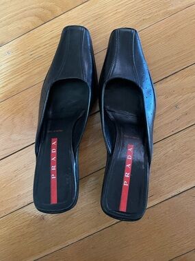Prada Black Leather Square-Toe Slip-On Mules with Red Logo Insole
